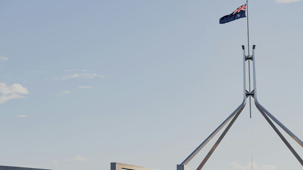 a flag is flying on top of a building